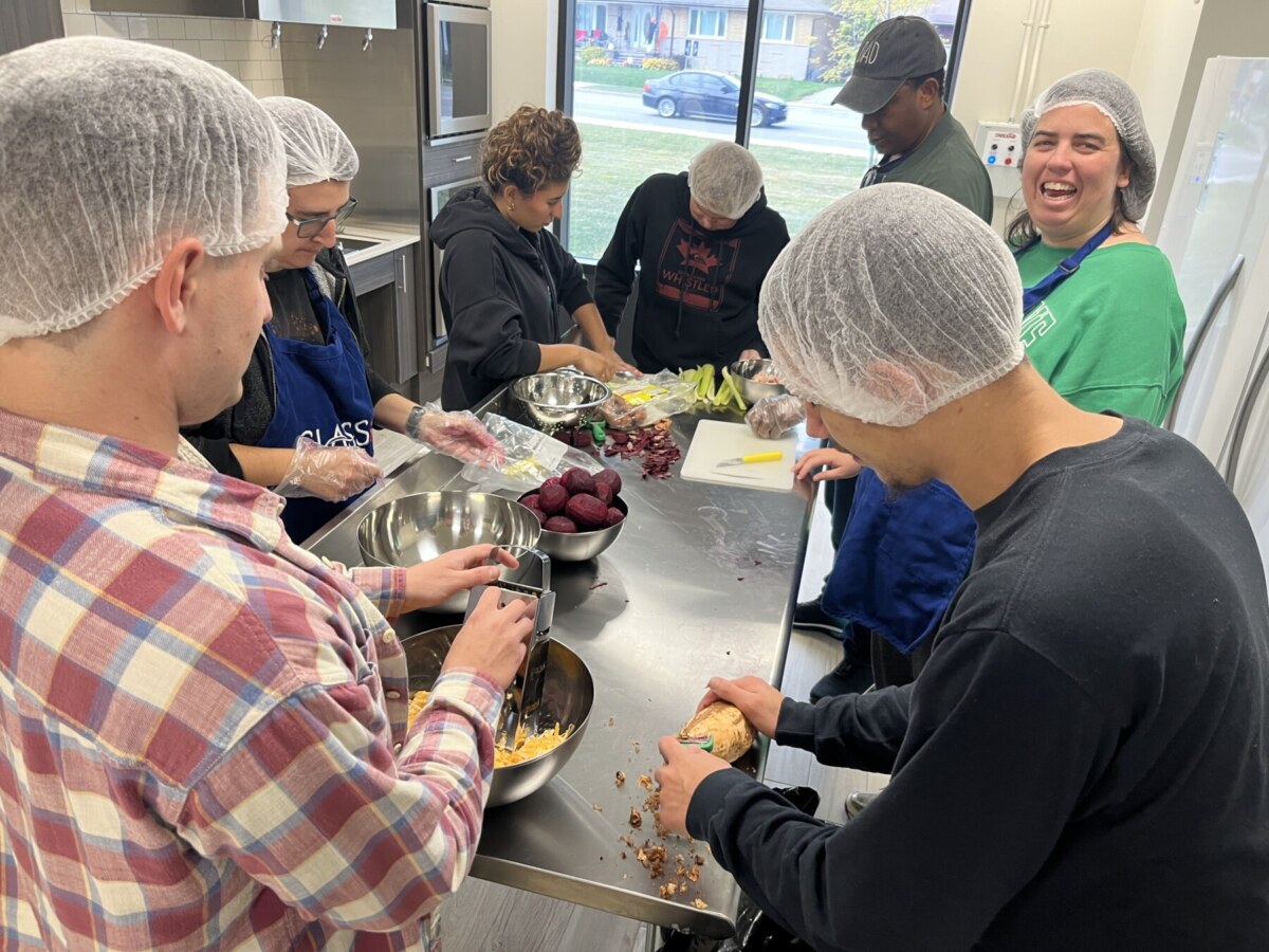 people supported by class learning soup making skills to prepare for opening of Bradford soup program