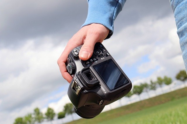 camera being held by a persons hand